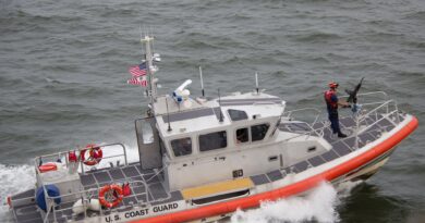 white orange u s coast guard boat on the sea